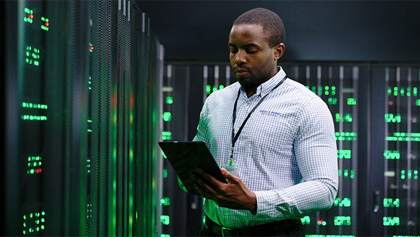 Data center employee working on devices