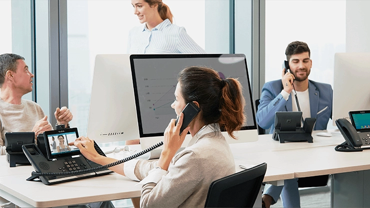 Remote working employees collaborating with Yealink business phone system