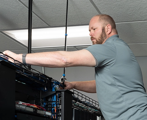 Employee installing professional data center solutions